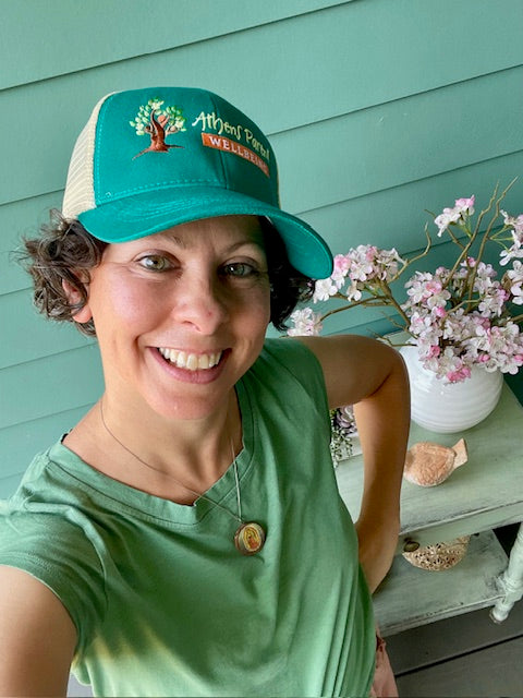 Athens Parent Wellbeing Embroidered Logo Trucker Hat in Emerald